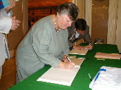 Signing the guest book.