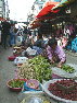 Vendors prepare vegetables